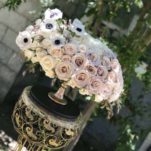 Blush and white rose bouquet with white anemones on an ornate stand
