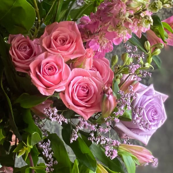 Pink and lavender roses with small purple filler flowers