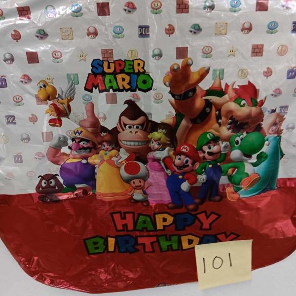 Super Mario birthday balloon with characters and colorful text