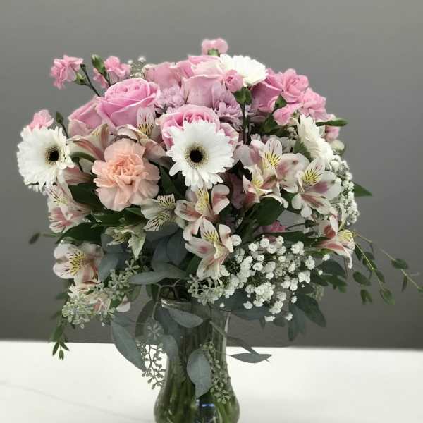 Pink and white mixed bouquet in a glass vase