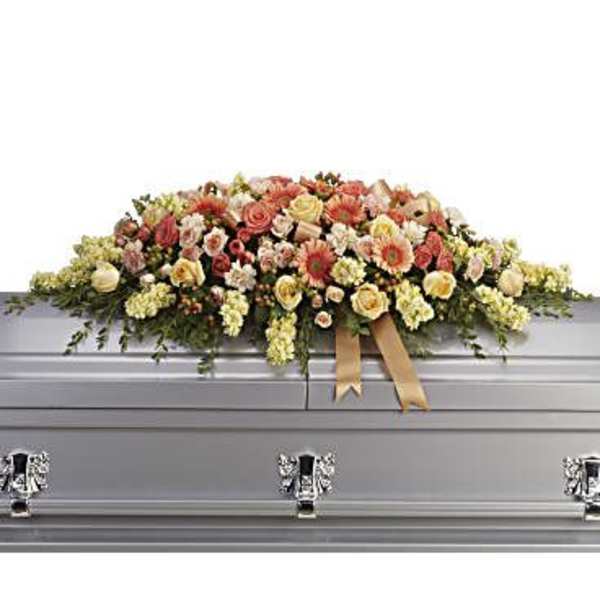 Large floral spray on a silver casket