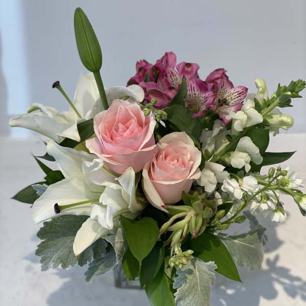 Bouquet of pink roses, white lilies, and magenta alstroemeria