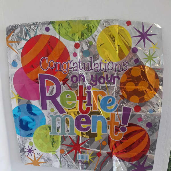 Foil balloon reading "Congratulations on your Retirement!"