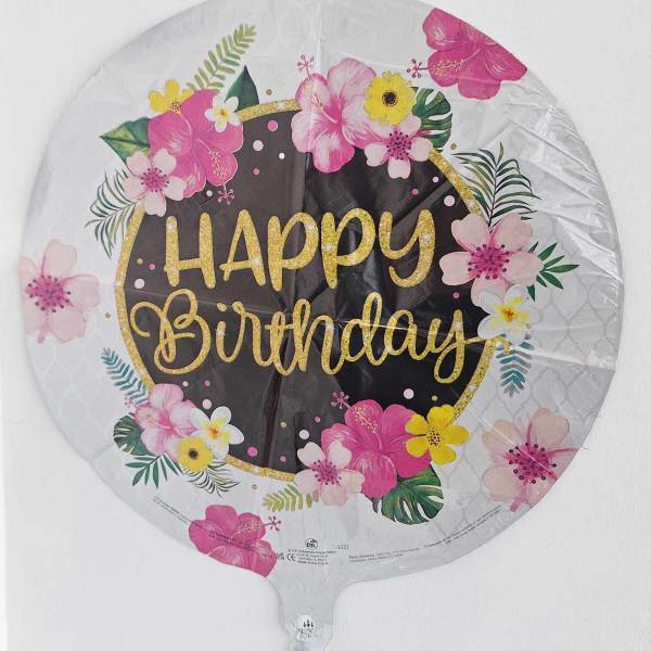 Round birthday balloon with pink and yellow floral print