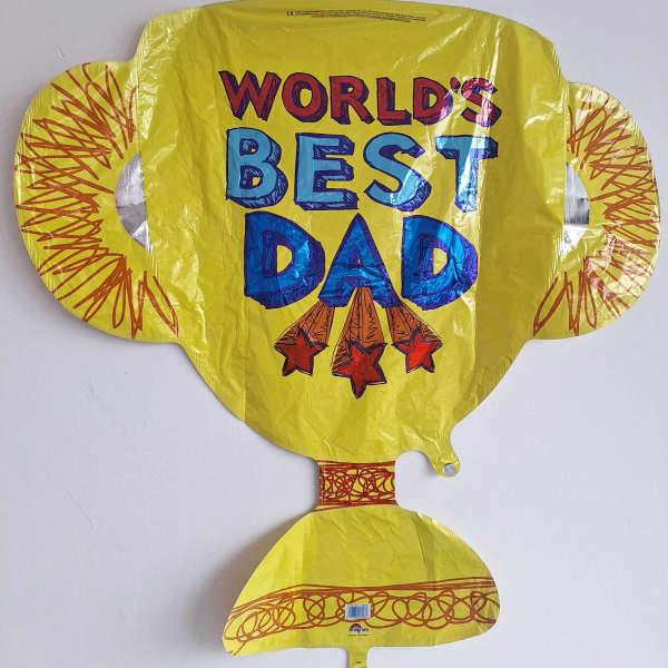 Yellow foil balloon reading "World's Best Dad"