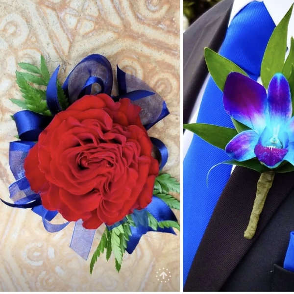 Red rose boutonniere with blue ribbon and green accents, plus a purple orchid boutonniere on a suit lapel