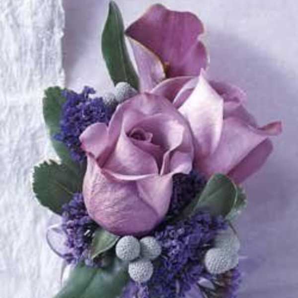 Purple calla lily bouquet with lavender ribbon and small purple accents