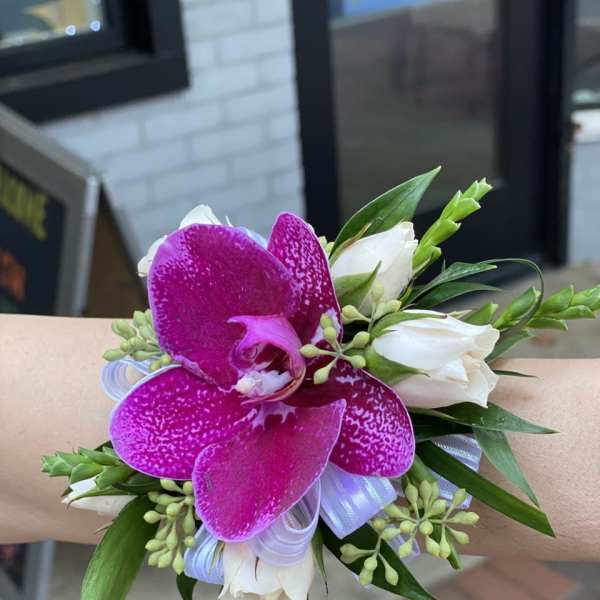 Wrist corsage with purple orchid and white roses