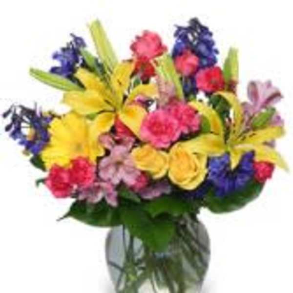 Colorful mixed bouquet in a clear glass vase