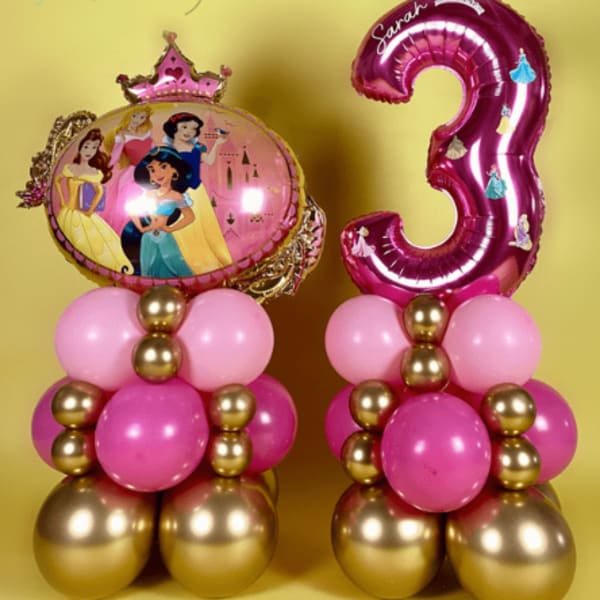 Princess-themed balloon arrangement with a pink number 3 balloon