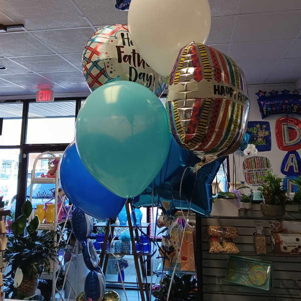 Cluster of Father’s Day balloons in blue, white, and patterned foil