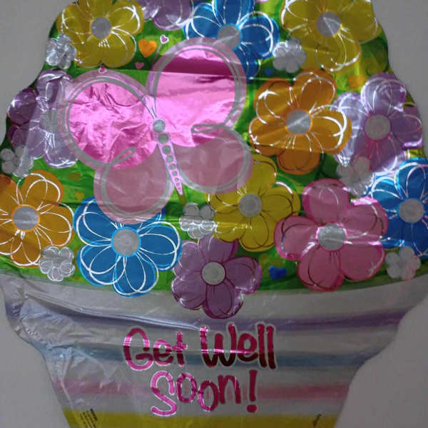 Colorful flower-shaped foil balloon with "Get Well Soon!" text