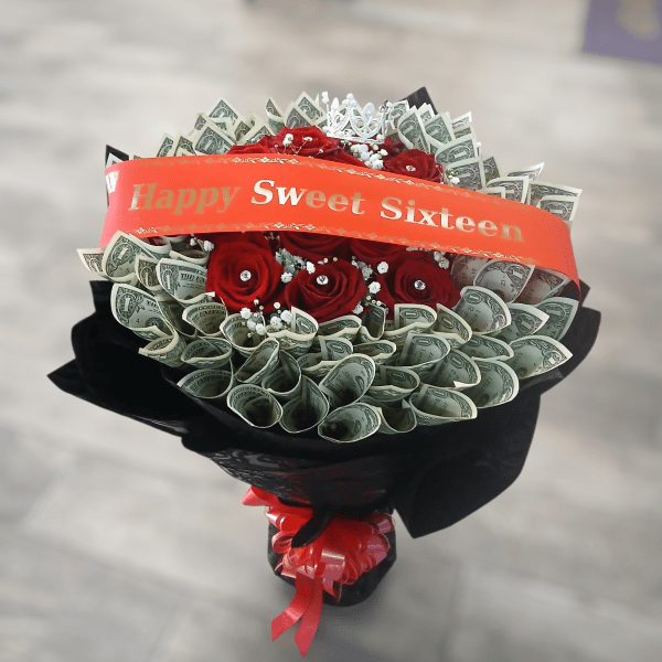 Bouquet of rolled dollar bills with red roses, a tiara, and a red Happy Sweet Sixteen ribbon.