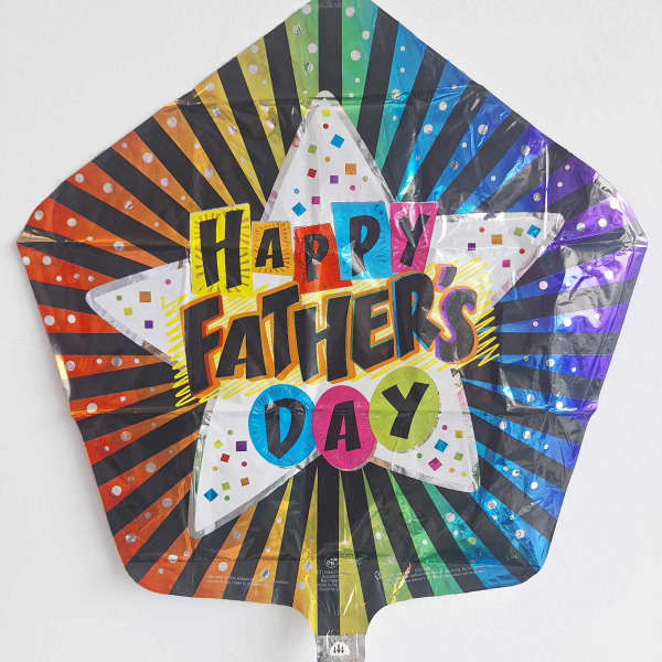 Rainbow foil balloon reading Happy Father's Day