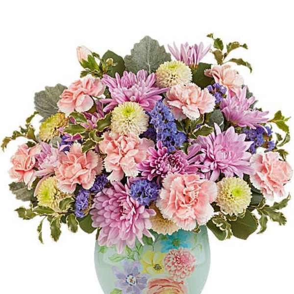 Pink and purple mixed bouquet in a painted ceramic vase