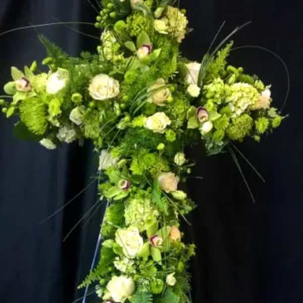 Green floral cross with white roses and hydrangeas