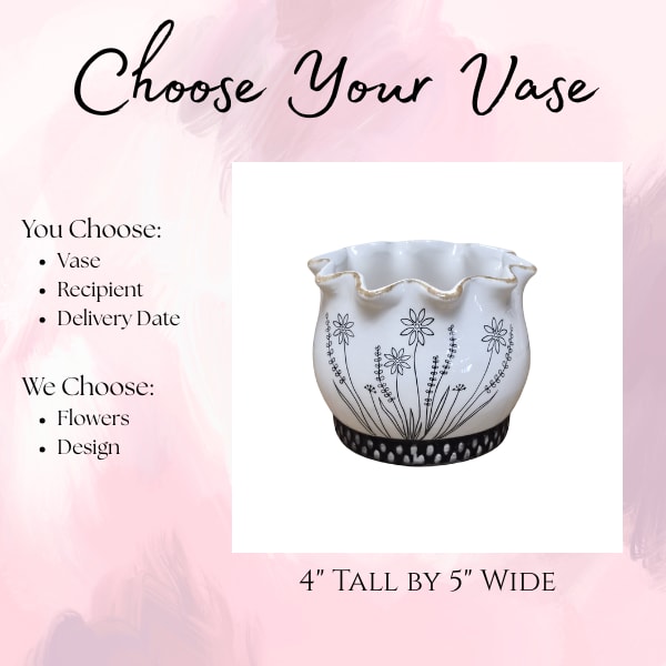 Decorative white ceramic vase with black floral pattern and scalloped rim