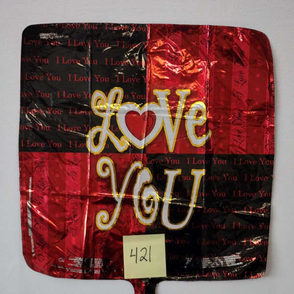 Red and black heart-themed foil balloon with "Love You" text