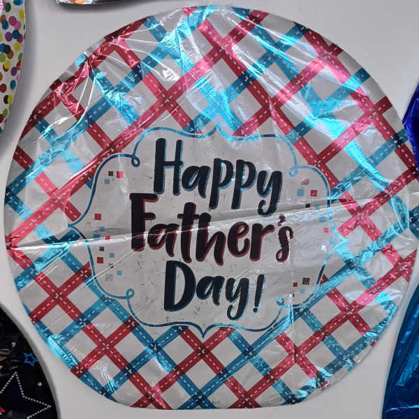 Round foil balloon reading Happy Father's Day