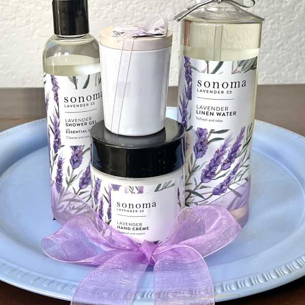 Lavender bath and linen gift set with ribbon on a tray