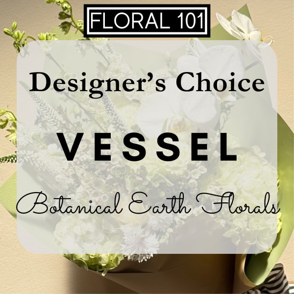 Designer’s choice floral vessel arrangement with white blooms and green accents
