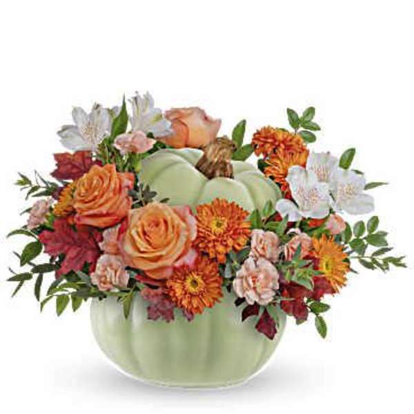 Pumpkin-shaped vase with orange and white flowers