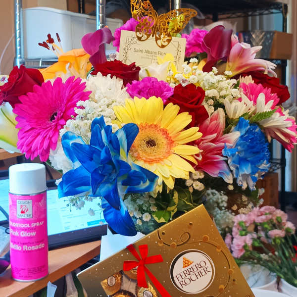 Bright mixed bouquet with a Ferrero Rocher box in front