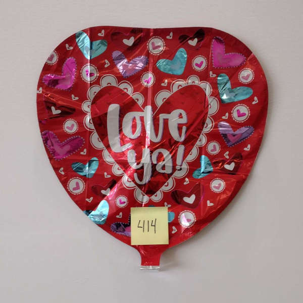 Heart-shaped red foil balloon with "Love ya!" text