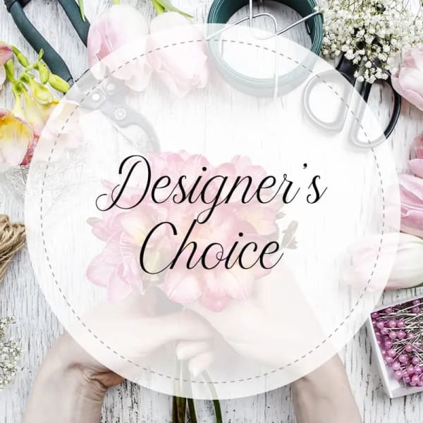 Round floral design board with pink flowers and craft tools