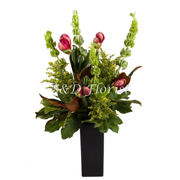 Pink tulips and green filler in a tall black vase