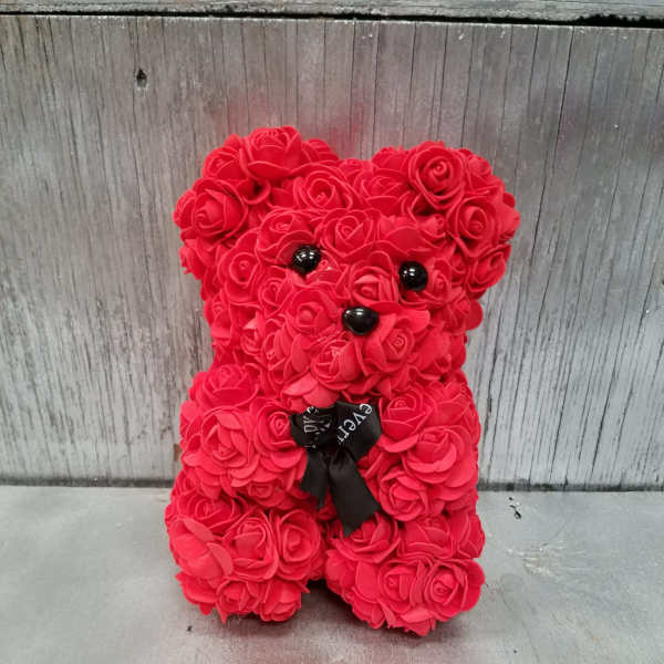Red rose teddy bear with black eyes and ribbon bow