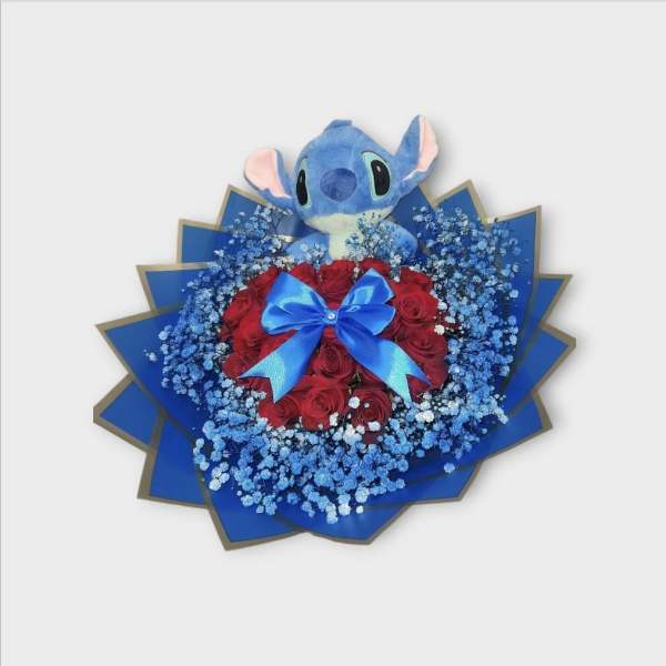 Plush Stitch toy above a bouquet of red roses with blue baby's breath and ribbon