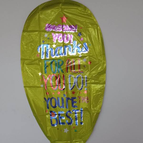 Yellow foil balloon with colorful thank-you text and stars