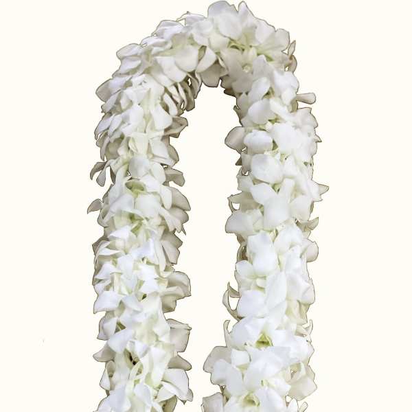 White flower lei made of clustered blossoms