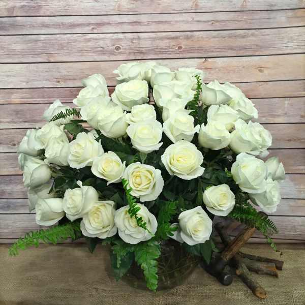 Bouquet of white roses in a glass vase