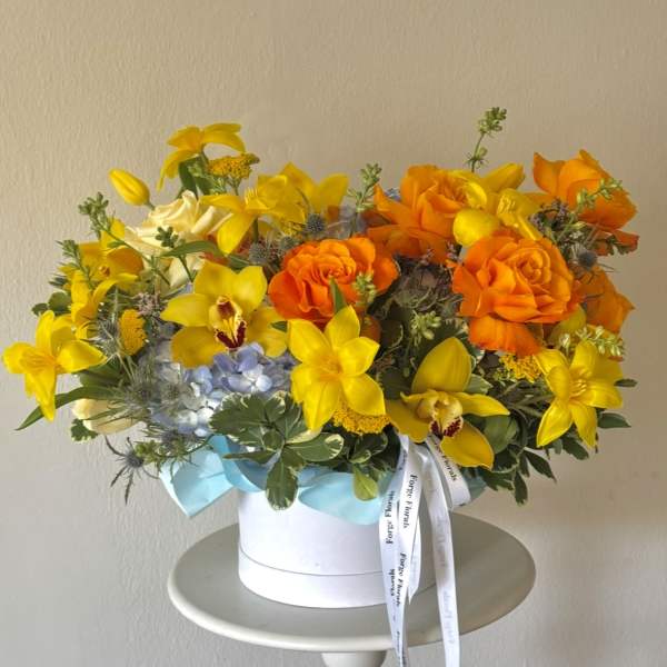 Sunshine Escape-Orchids, roses, hydrangeas,tulips(will be replaced when not in season)