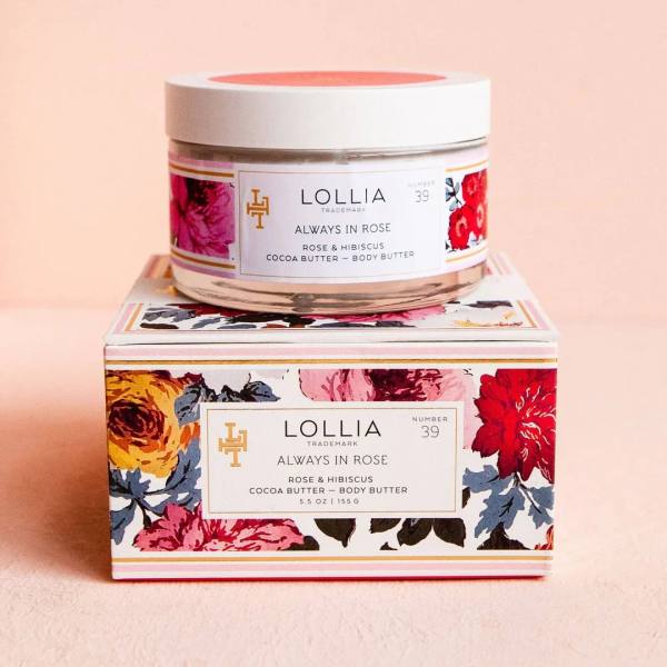 Jar of rose body butter on a floral-patterned box