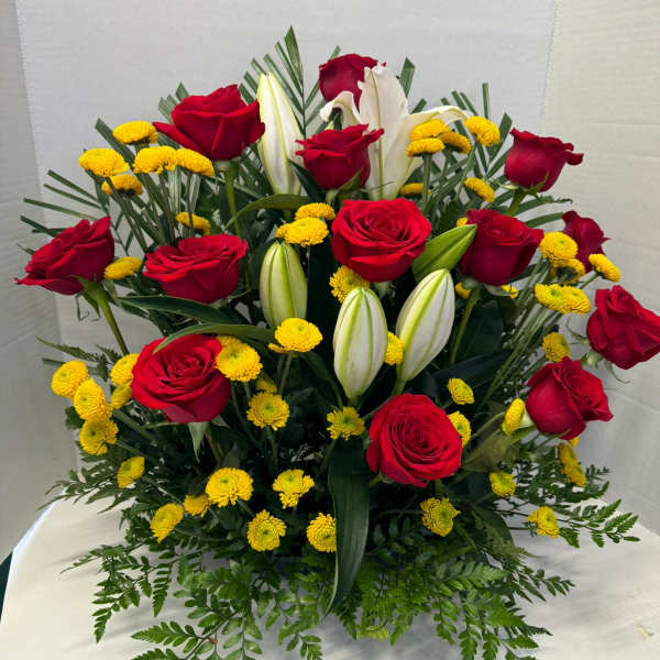 Bouquet of red roses, white lilies, and yellow button mums