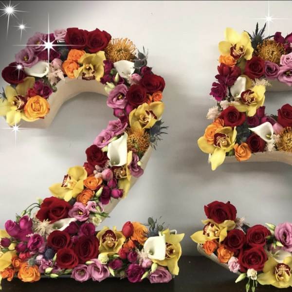 Floral number 25 covered in roses and orchids