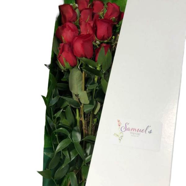 Bouquet of red roses in a white gift box