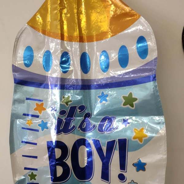 Blue and gold foil balloon reading "it's a BOY!"