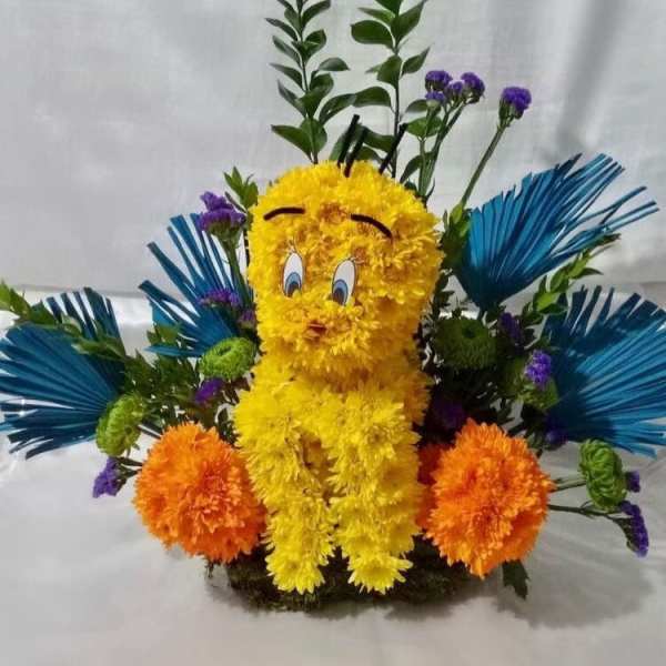 Yellow floral character arrangement with blue and orange accents