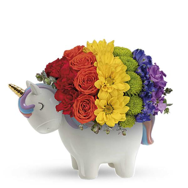 Rainbow flower arrangement in a unicorn-shaped ceramic container
