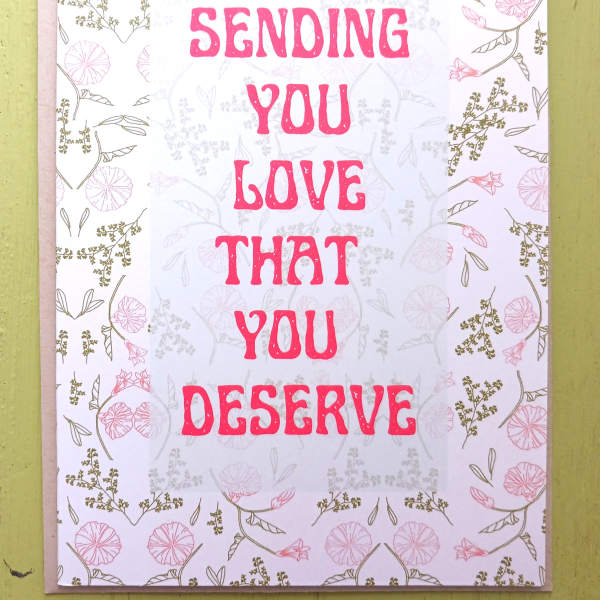 Pink and white greeting card with floral border and text sending you love that you deserve