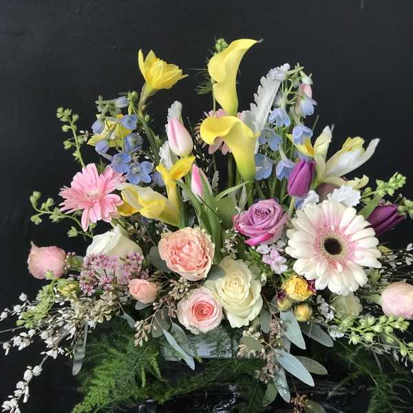 Mixed bouquet with yellow calla lilies, pink roses, and gerbera daisies