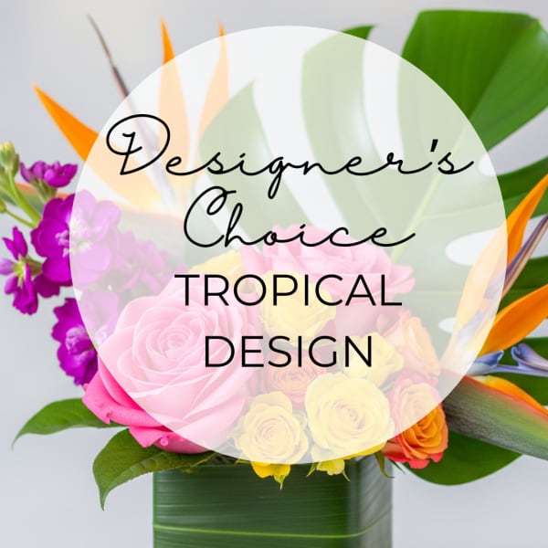 Tropical bouquet with pink roses and bird of paradise in a green vase