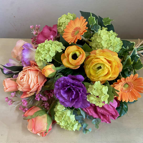 Colorful bouquet with roses, gerbera daisies, and hydrangeas