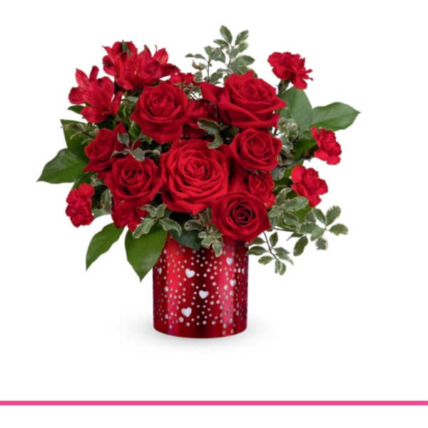 Red roses and carnations in a heart-patterned red vase