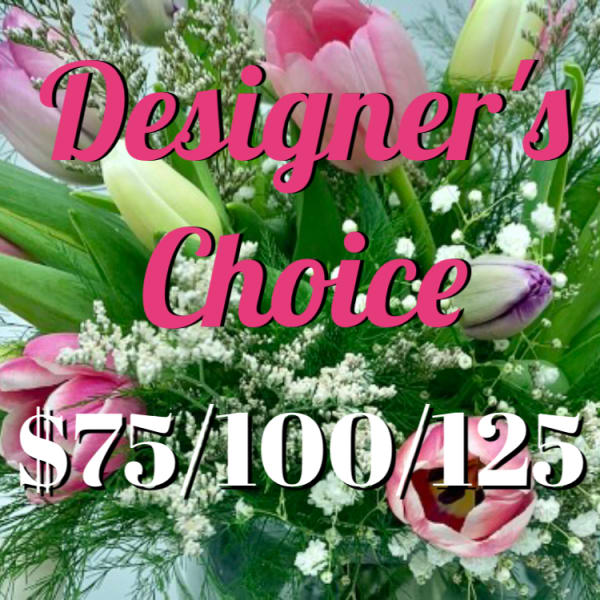 Pink and white tulip arrangement with baby's breath in a clear glass vase and Designer's Choice pricing text.