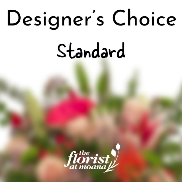 Designer’s Choice Standard floral arrangement with blurred pink and peach blooms